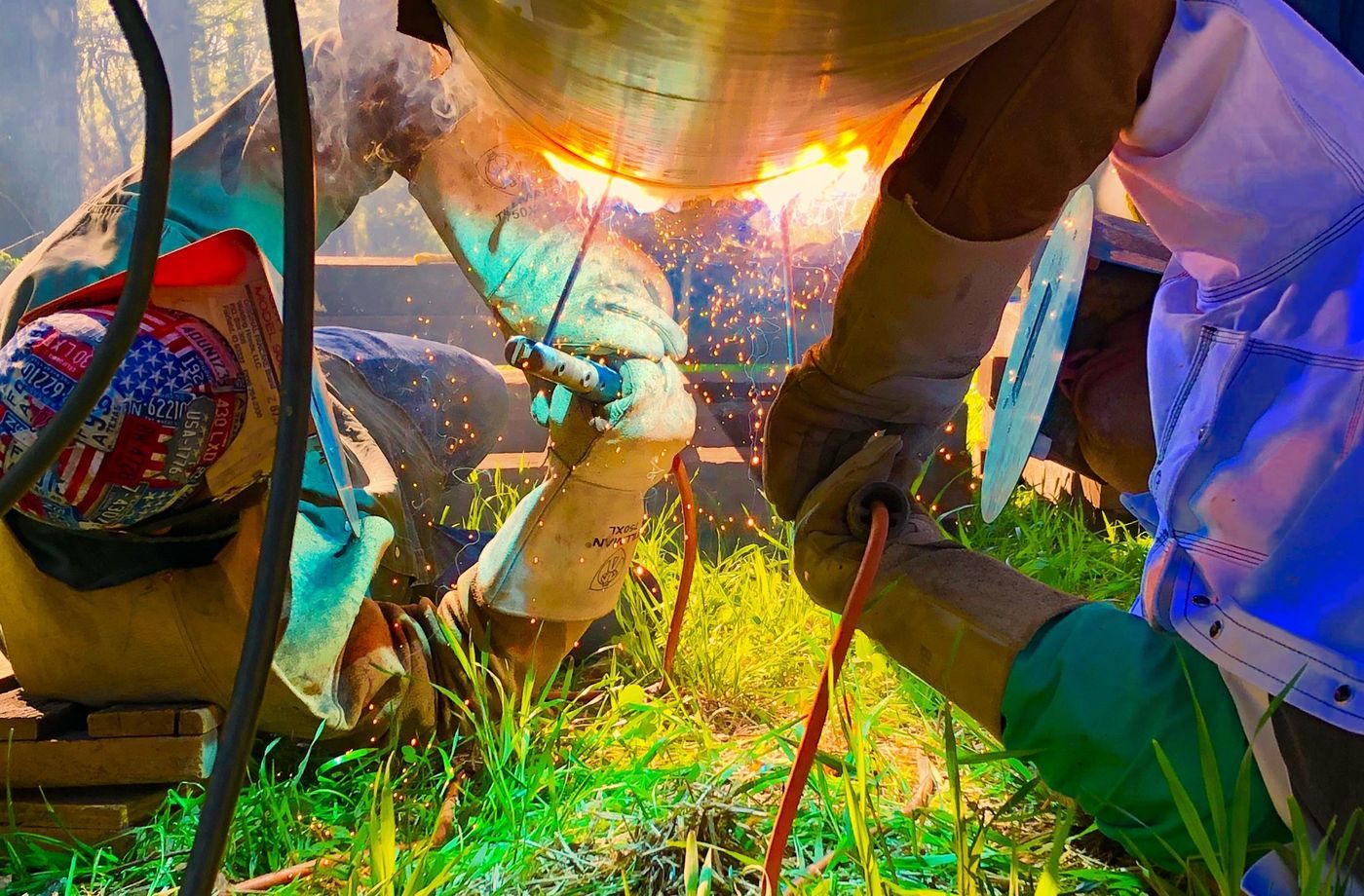 Close-up of a weld in progress with sparks
